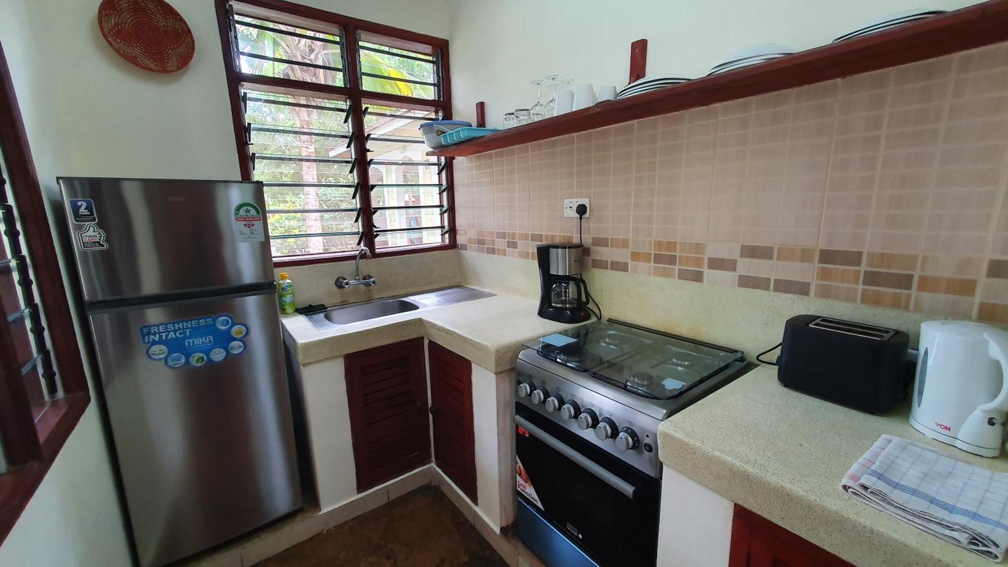 Safina Cottages Diani Beach Exterior photo